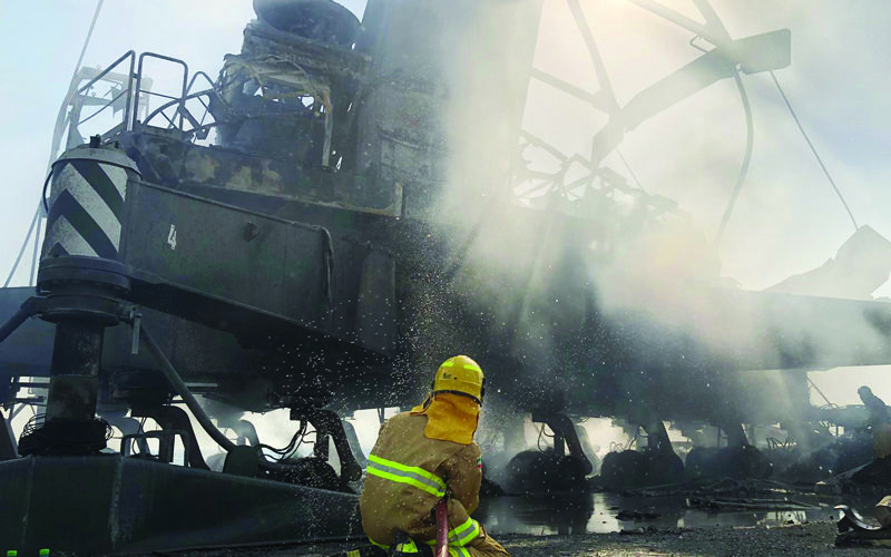 Firemen battle container crane fire at Shuaiba Port